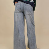 Emery Wide Leg Jeans in vintage light wash denim with patch back pockets — Paper Doll
