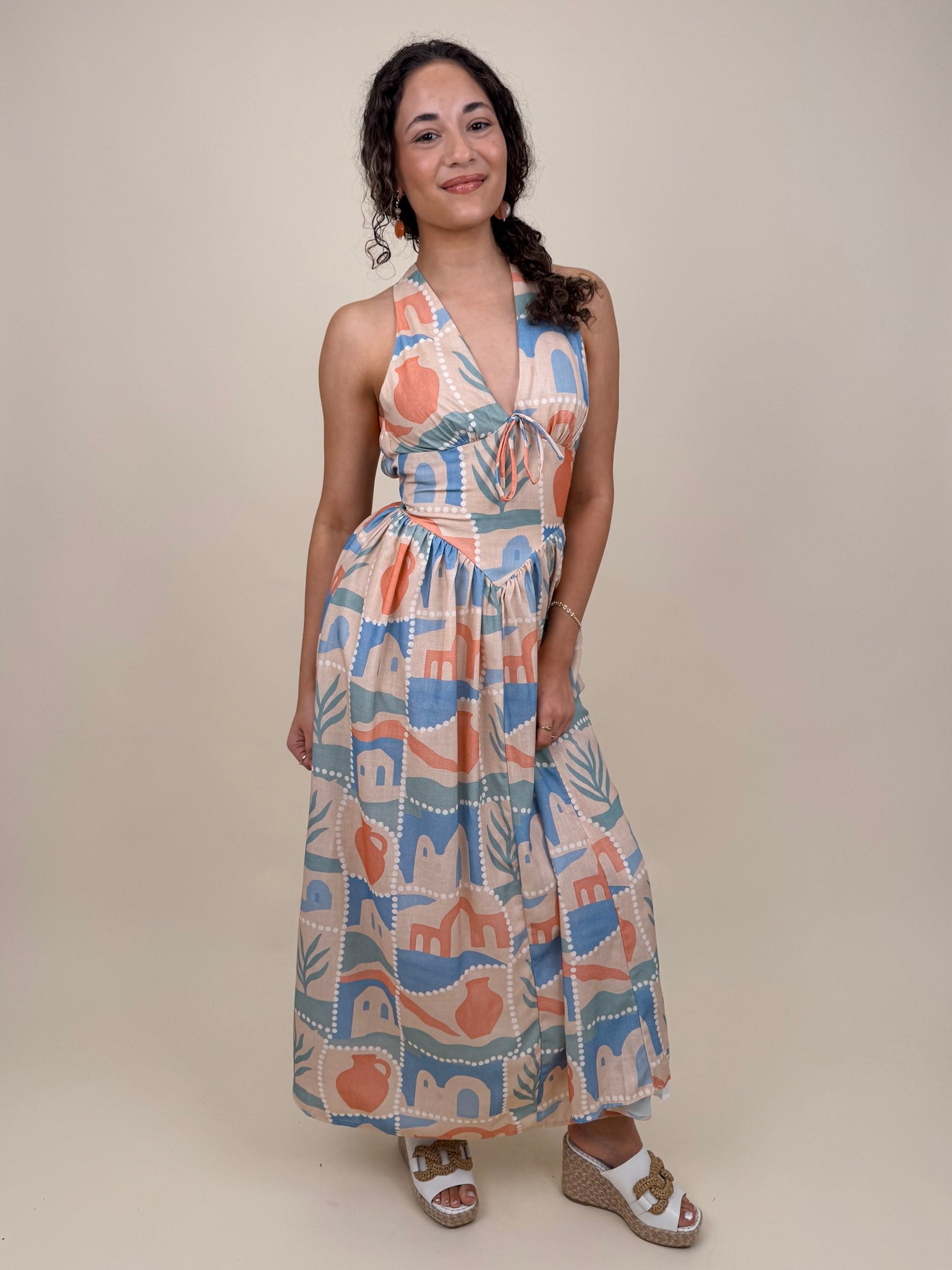 Off To Kokomo Maxi Dress in beige multi stamp print with halter neckline and open back bow — Paper Doll
