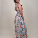 Off To Kokomo Maxi Dress in beige multi stamp print with halter neckline and open back bow — Paper Doll
