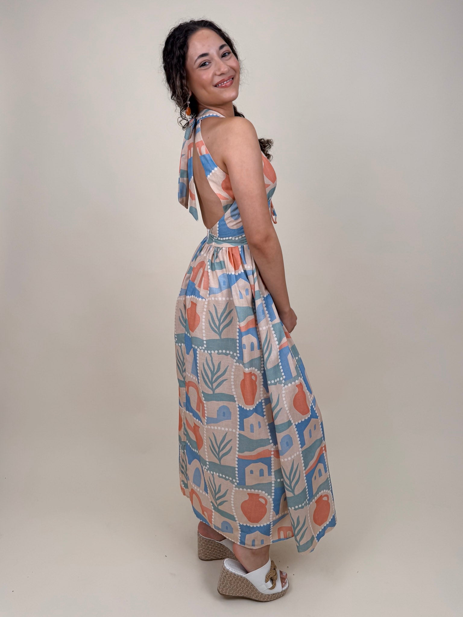 Off To Kokomo Maxi Dress in beige multi stamp print with halter neckline and open back bow — Paper Doll
