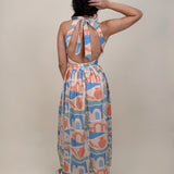 Off To Kokomo Maxi Dress in beige multi stamp print with halter neckline and open back bow — Paper Doll
