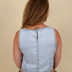 Zena Round Neck Top in light wash denim with a sleeveless cut and keyhole back — Paper Doll