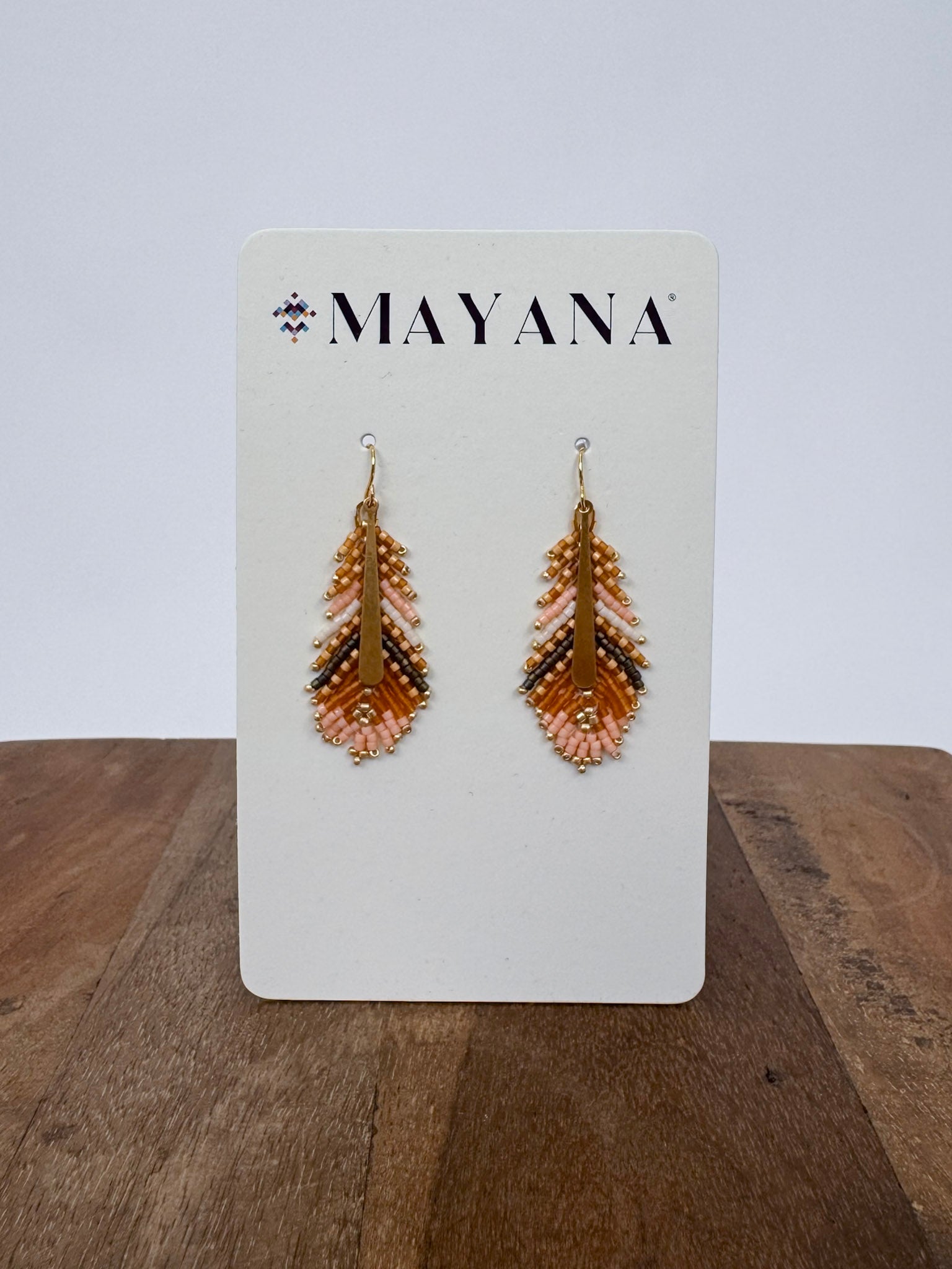 Gilded Feather Earrings with peach, cream, and tan beadwork and a gold quill center — Paper Doll