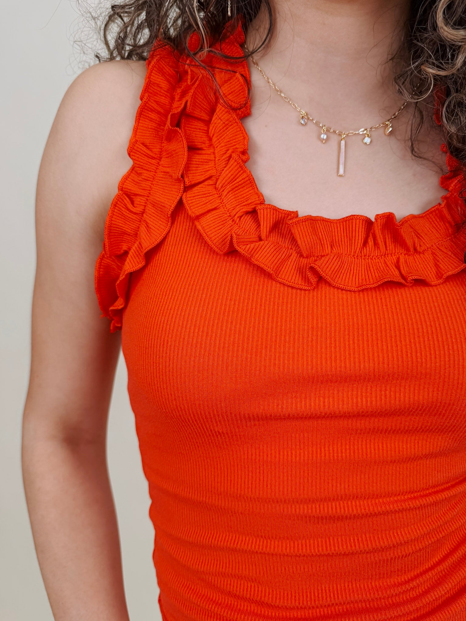Tammy Ruffle Tank in red with a ruffle shoulder and neckline — Paper Doll