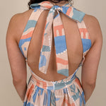 Off To Kokomo Maxi Dress in beige multi stamp print with halter neckline and open back bow — Paper Doll

