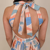 Off To Kokomo Maxi Dress in beige multi stamp print with halter neckline and open back bow — Paper Doll

