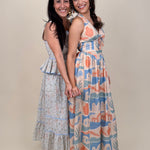 Off To Kokomo Maxi Dress in beige multi stamp print with halter neckline and open back bow — Paper Doll
