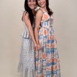 Off To Kokomo Maxi Dress in beige multi stamp print with halter neckline and open back bow — Paper Doll
