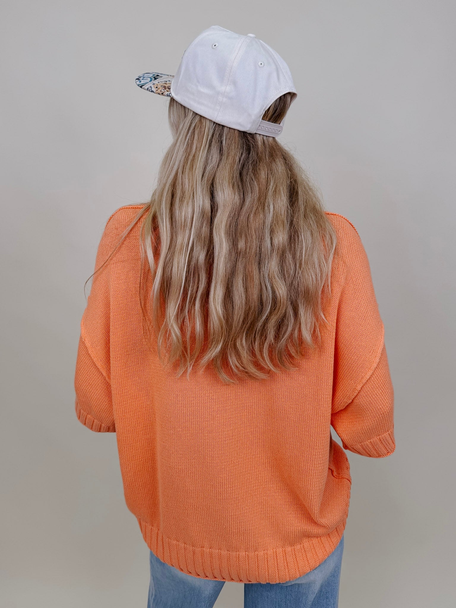Hilda Oversized Sweater in bright peach with a mock neck and elbow sleeves — Paper Doll
