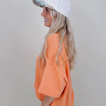 Hilda Oversized Sweater in bright peach with a mock neck and elbow sleeves — Paper Doll

