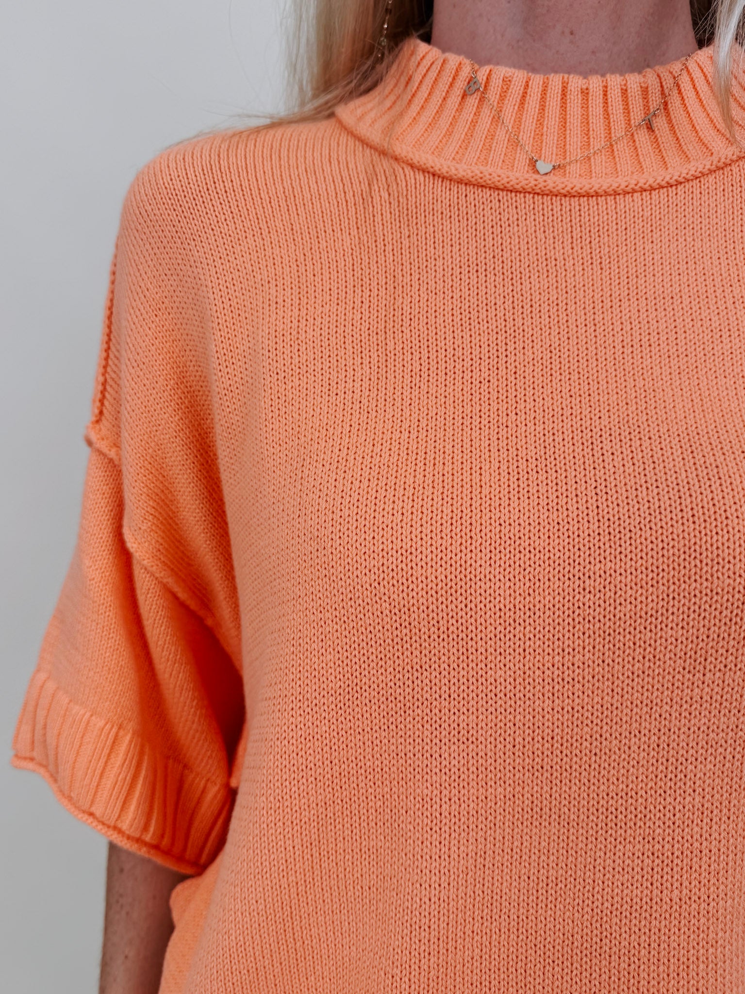 Hilda Oversized Sweater in bright peach with a mock neck and elbow sleeves — Paper Doll
