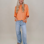 Hilda Oversized Sweater in bright peach with a mock neck and elbow sleeves — Paper Doll

