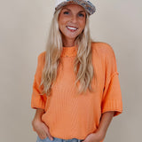 Hilda Oversized Sweater in bright peach with a mock neck and elbow sleeves — Paper Doll
