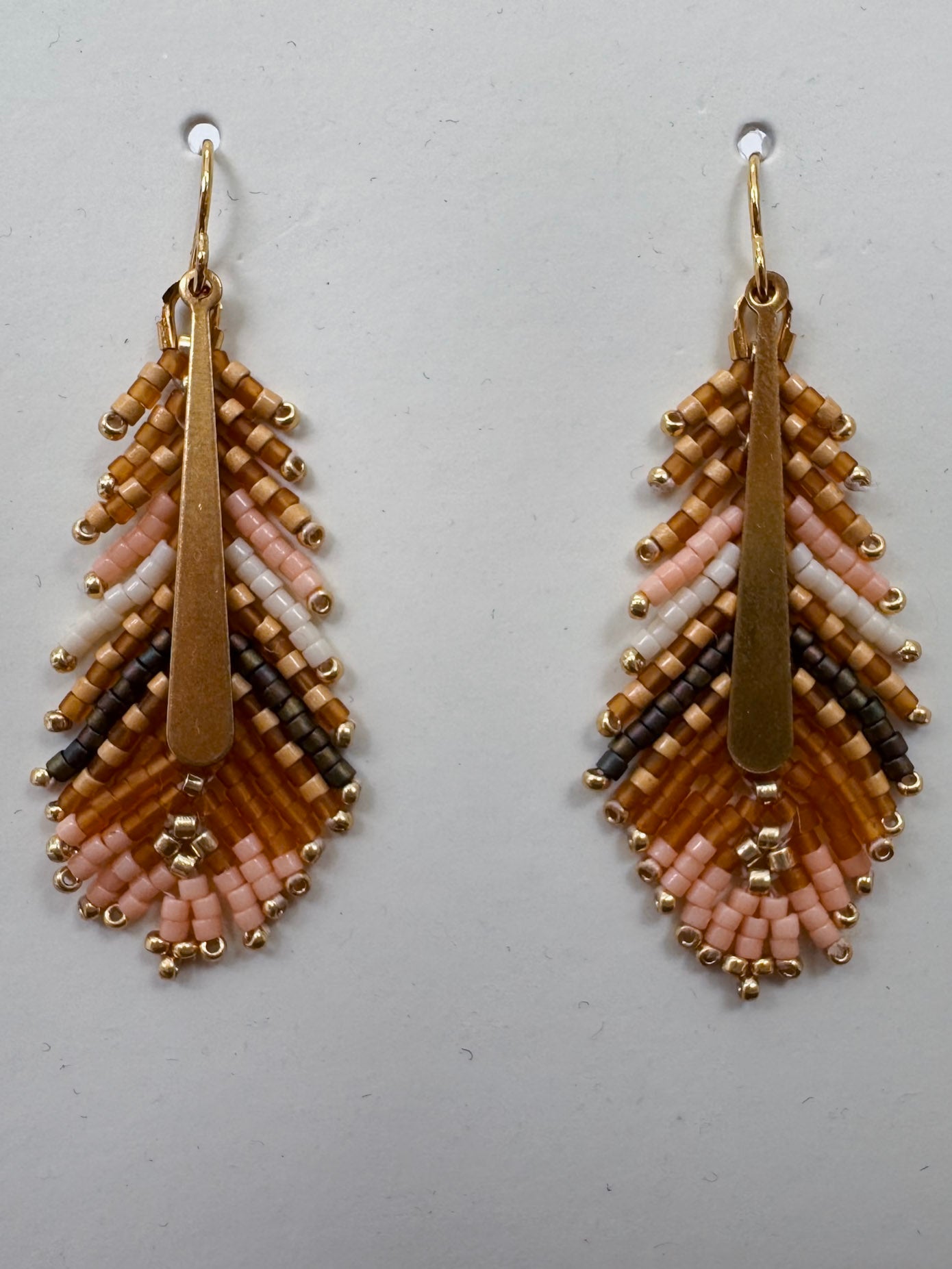 Gilded Feather Earrings with peach, cream, and tan beadwork and a gold quill center — Paper Doll