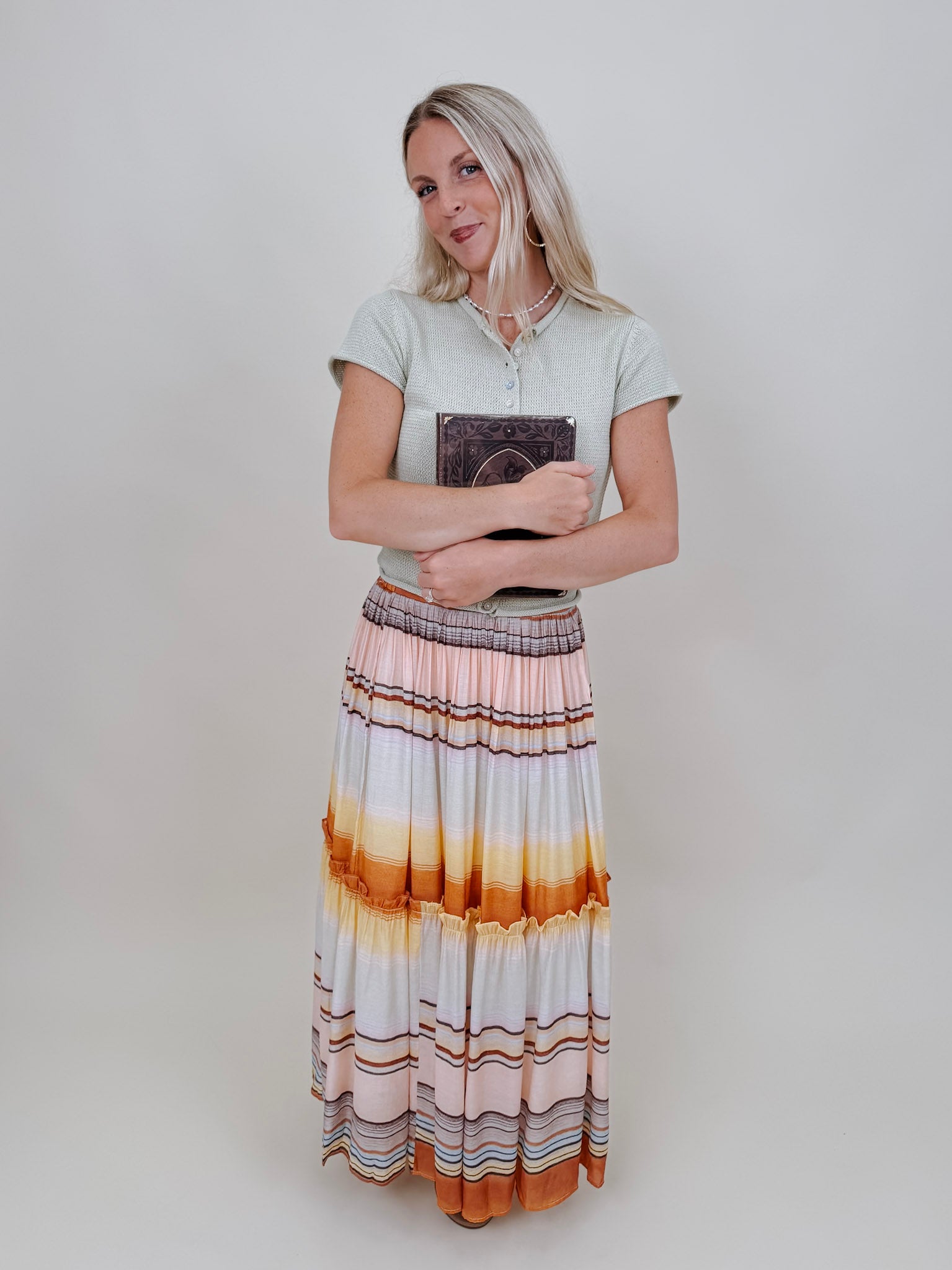 Sunset Tiered Maxi Skirt in an ombré sunset stripe of peach, gold, and rust — Paper Doll
