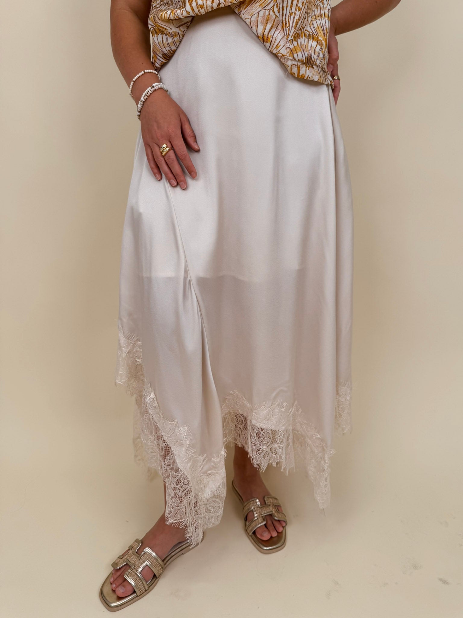 Kara Lace Trim Skirt in ivory satin with eyelash lace asymmetric hem — Paper Doll