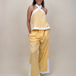 Walking At Sunset Top in lemon yellow with cross-halter neckline and white contrast trim — Paper Doll

