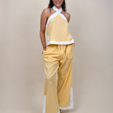 Walking At Sunset Top in lemon yellow with cross-halter neckline and white contrast trim — Paper Doll
