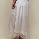 Kara Lace Trim Skirt in ivory satin with eyelash lace asymmetric hem — Paper Doll