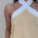 Walking At Sunset Top in lemon yellow with cross-halter neckline and white contrast trim — Paper Doll
