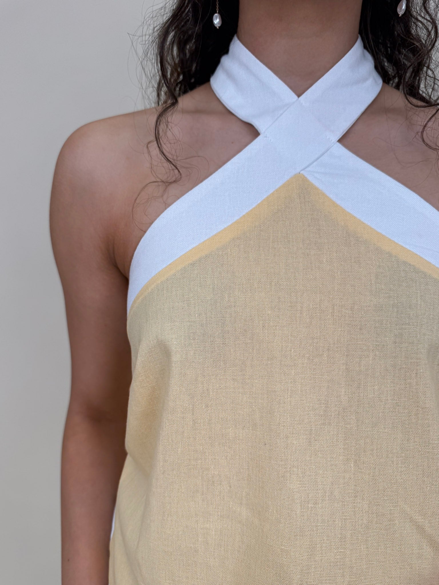 Walking At Sunset Top in lemon yellow with cross-halter neckline and white contrast trim — Paper Doll
