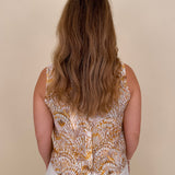 Sandy Seashell Print Top in golden seashell print with buttoned keyhole back — Paper Doll