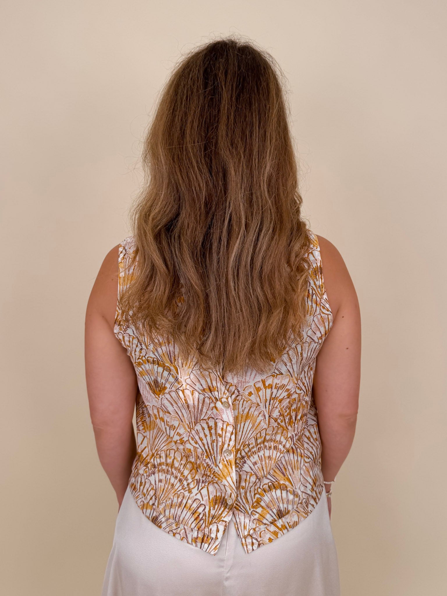 Sandy Seashell Print Top in golden seashell print with buttoned keyhole back — Paper Doll