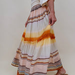 Sunset Tiered Maxi Skirt in an ombré sunset stripe of peach, gold, and rust — Paper Doll
