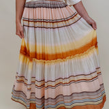 Sunset Tiered Maxi Skirt in an ombré sunset stripe of peach, gold, and rust — Paper Doll
