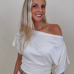 Tara Draped Sleeve Blouse in cream with an off-shoulder neckline and draped sleeves — Paper Doll
