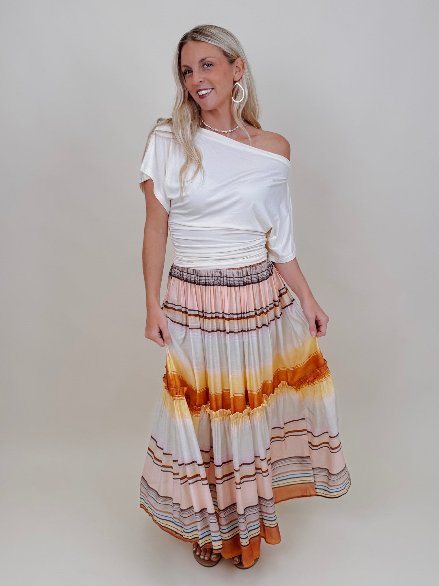 Tara Draped Sleeve Blouse in cream with an off-shoulder neckline and draped sleeves — Paper Doll
