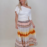 Sunset Tiered Maxi Skirt in an ombré sunset stripe of peach, gold, and rust — Paper Doll
