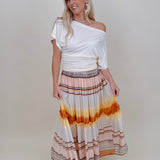 Sunset Tiered Maxi Skirt in an ombré sunset stripe of peach, gold, and rust — Paper Doll
