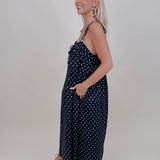 Kerry Polka Dot Midi Dress in navy with white polka dots and tie straps — Paper Doll
