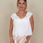 Hadleigh Smocked Neckline Blouse in white with tie neckline and flutter sleeves — Paper Doll