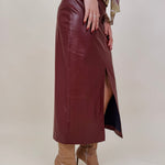 Hailey Midi Skirt in burgundy faux leather with front slit — Paper Doll