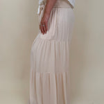 Evanthe Tie-Waist Wide Leg Pants in cream with tiered wide-leg and tassel tie — Paper Doll