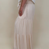 Evanthe Tie-Waist Wide Leg Pants in cream with tiered wide-leg and tassel tie — Paper Doll