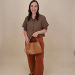 Belle Plaid Button Up Top in chocolate brown and cream windowpane plaid with covered buttons, a ruffled collar, and cuffed short sleeves