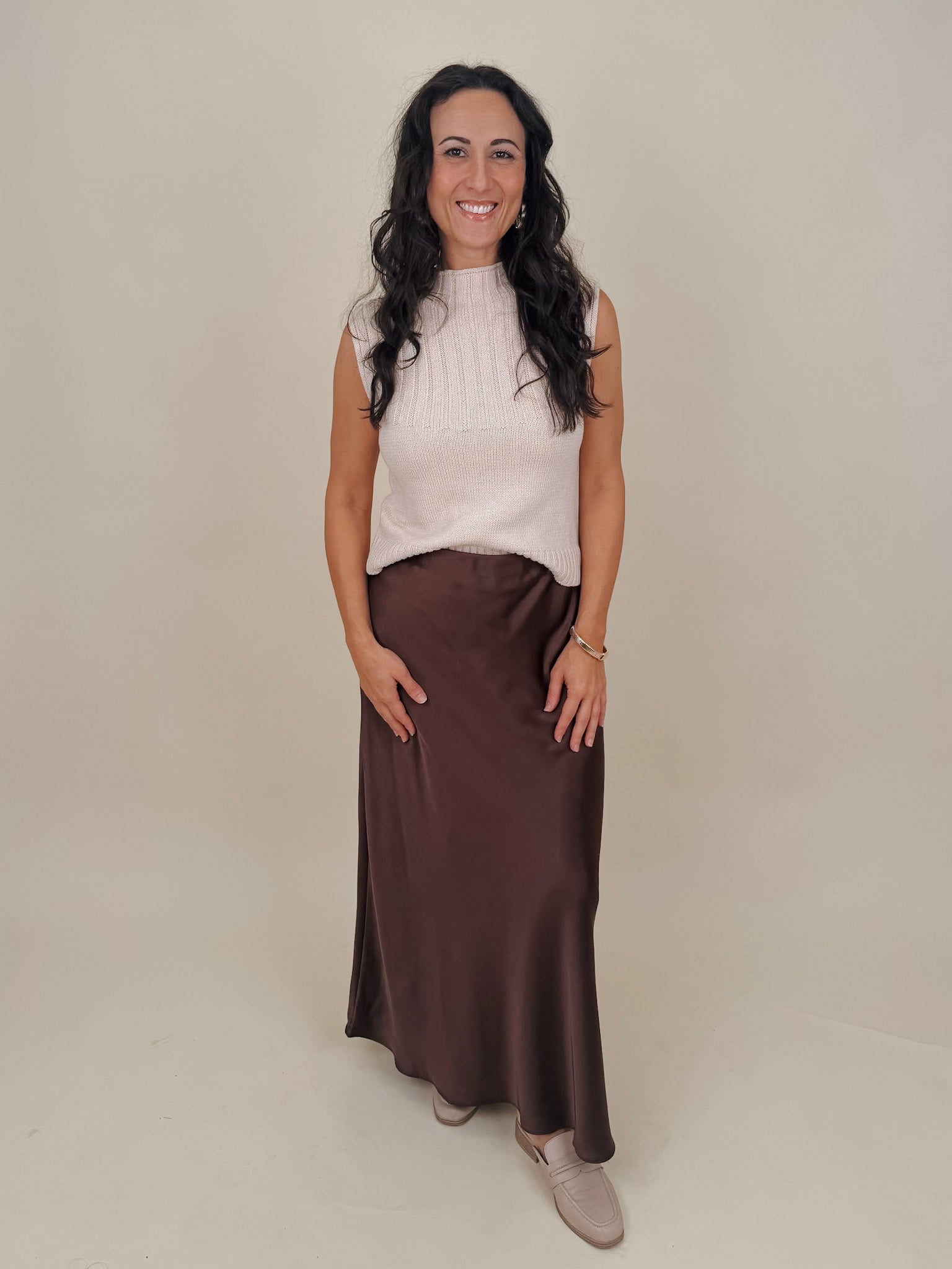 Blair Mock Neck Knit Top in cream with a textured rib knit, mock neckline, sleeveless cap shoulders, and a ribbed waist hem