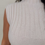 Blair Mock Neck Knit Top in cream with a textured rib knit, mock neckline, sleeveless cap shoulders, and a ribbed waist hem