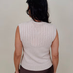 Blair Mock Neck Knit Top in cream with a textured rib knit, mock neckline, sleeveless cap shoulders, and a ribbed waist hem