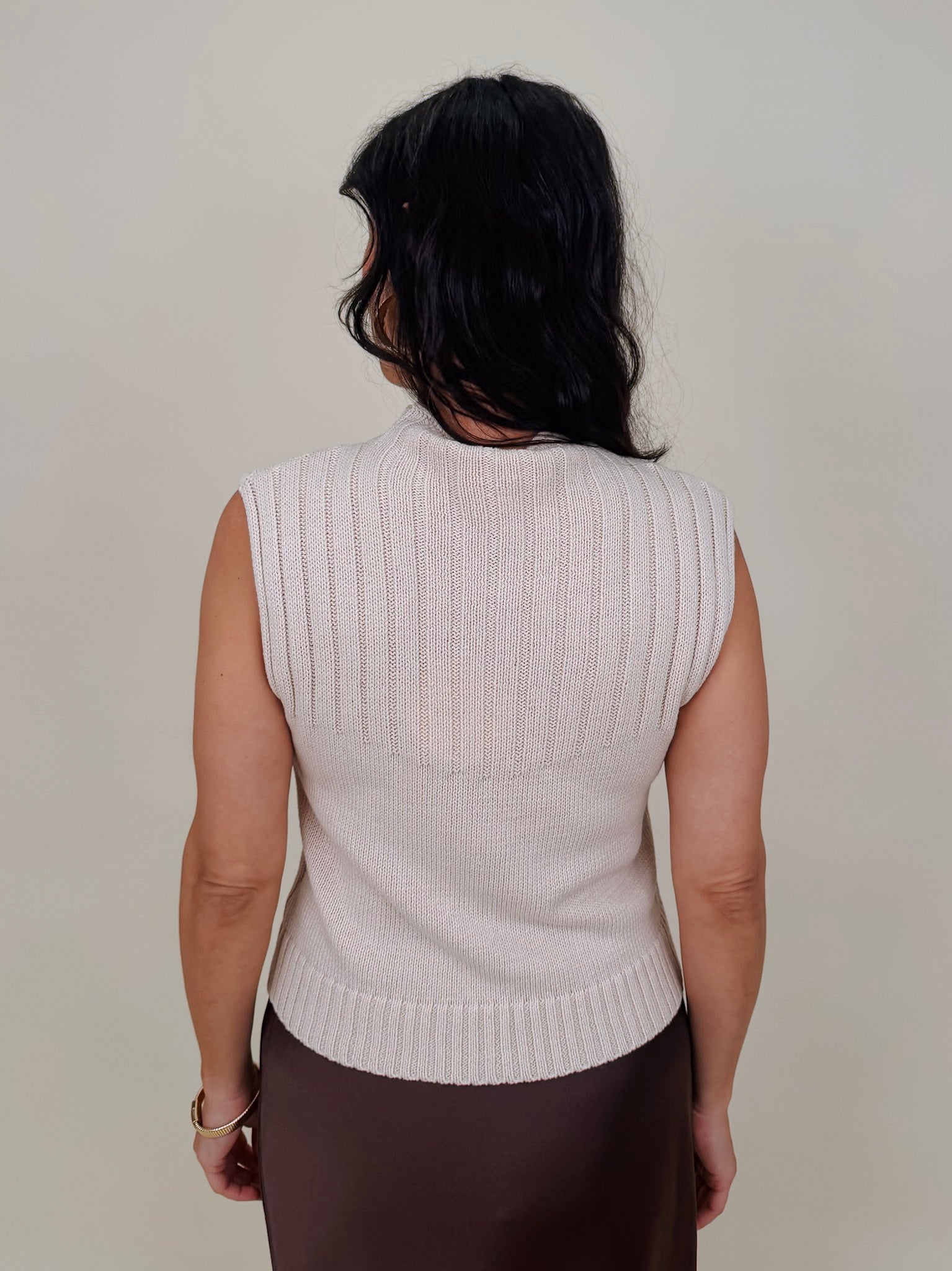 Blair Mock Neck Knit Top in cream with a textured rib knit, mock neckline, sleeveless cap shoulders, and a ribbed waist hem