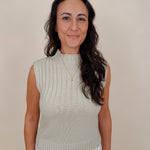 Blair Mock Neck Knit Top in soft light green with a textured rib knit, mock neckline, sleeveless cap shoulders, and a ribbed waist hem