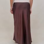 Juliette Satin Midi Skirt in chocolate brown with a smooth elastic waist and a bias cut silhouette that flares softly at the hem