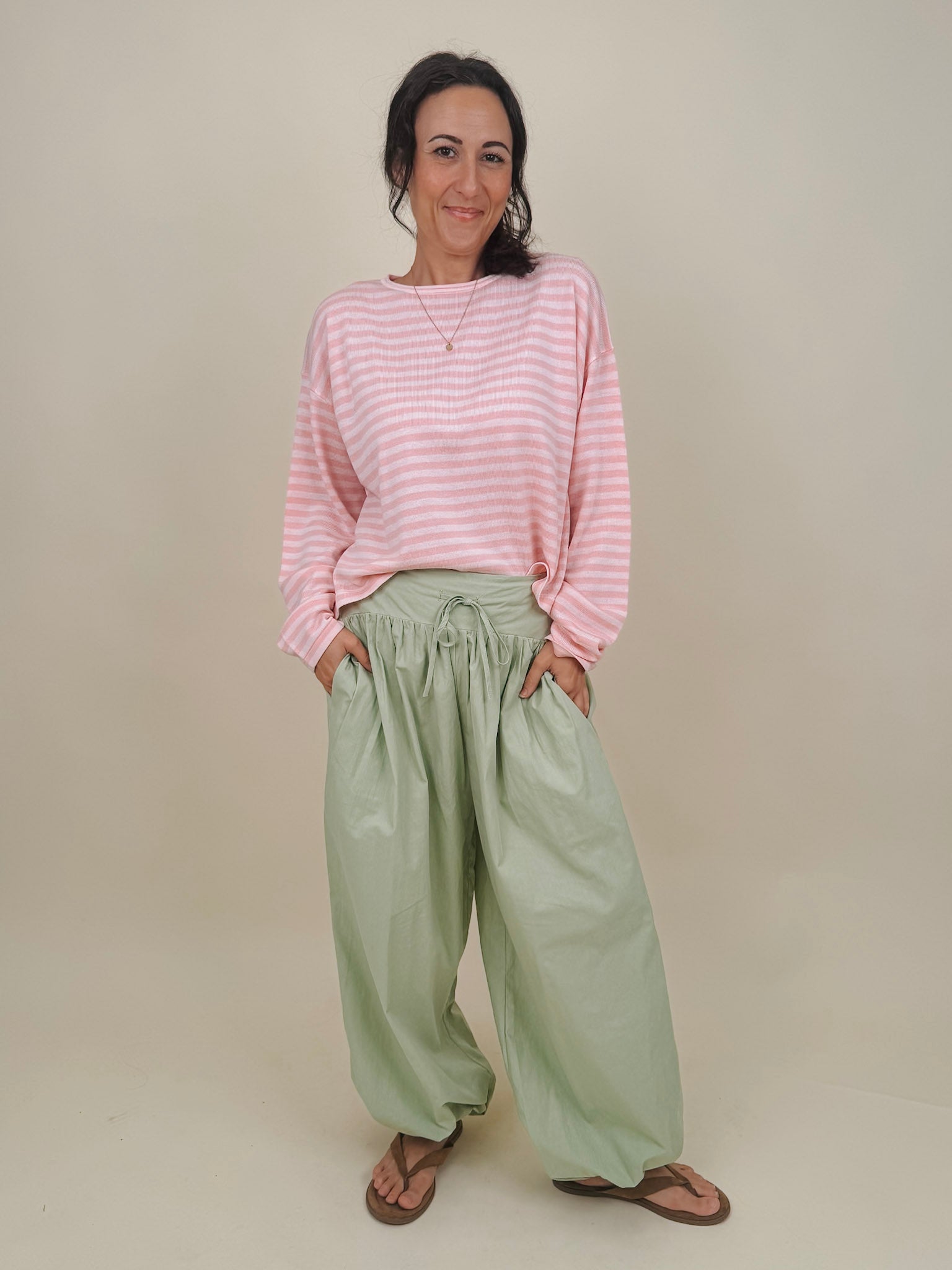 Kingston Striped Sweater in blush pink and ivory stripes with a relaxed drop shoulder, boxy body, and long sleeves in a lightweight knit.