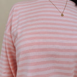 Kingston Striped Sweater in blush pink and ivory stripes with a relaxed drop shoulder, boxy body, and long sleeves in a lightweight knit.
