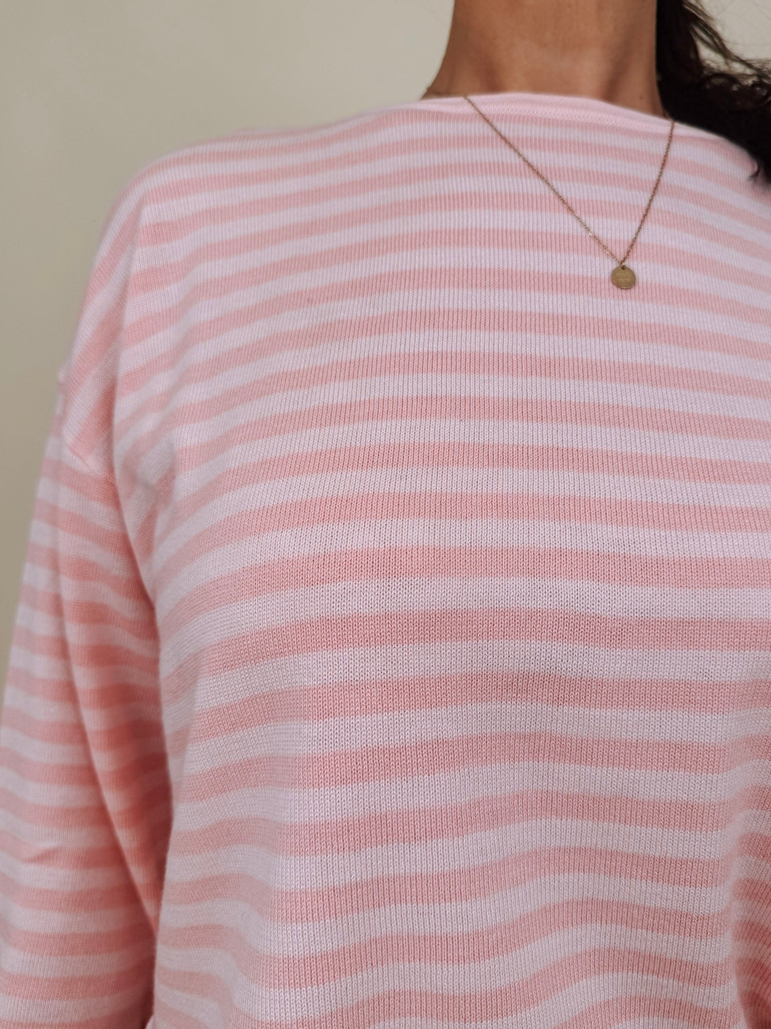 Kingston Striped Sweater in blush pink and ivory stripes with a relaxed drop shoulder, boxy body, and long sleeves in a lightweight knit.
