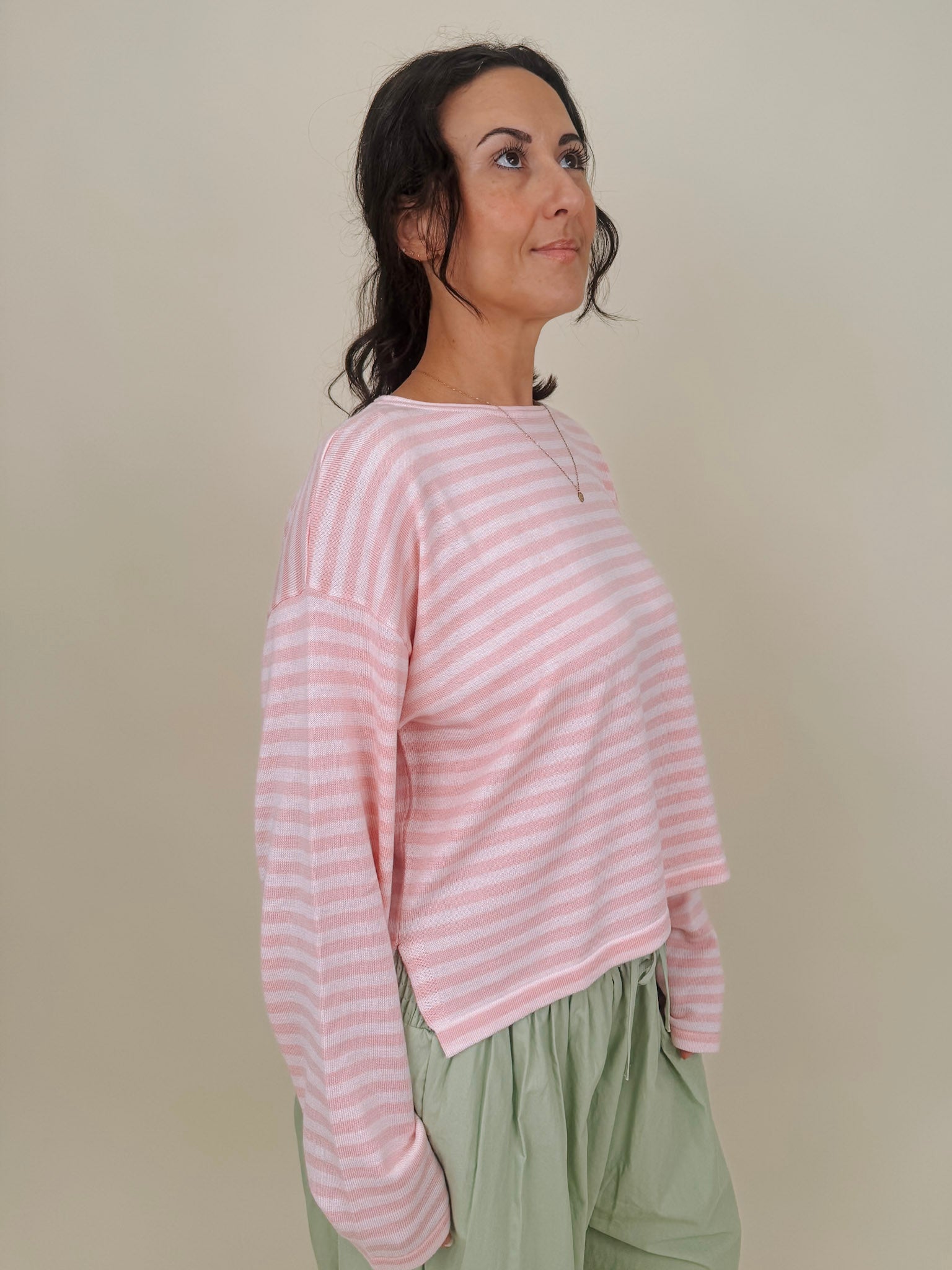 Kingston Striped Sweater in blush pink and ivory stripes with a relaxed drop shoulder, boxy body, and long sleeves in a lightweight knit.