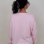Kingston Striped Sweater in blush pink and ivory stripes with a relaxed drop shoulder, boxy body, and long sleeves in a lightweight knit.